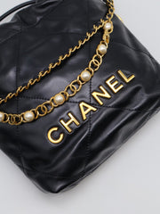 CHANEL 22 Mini Handbag with Pearl Chain - Black with Gold Hardware